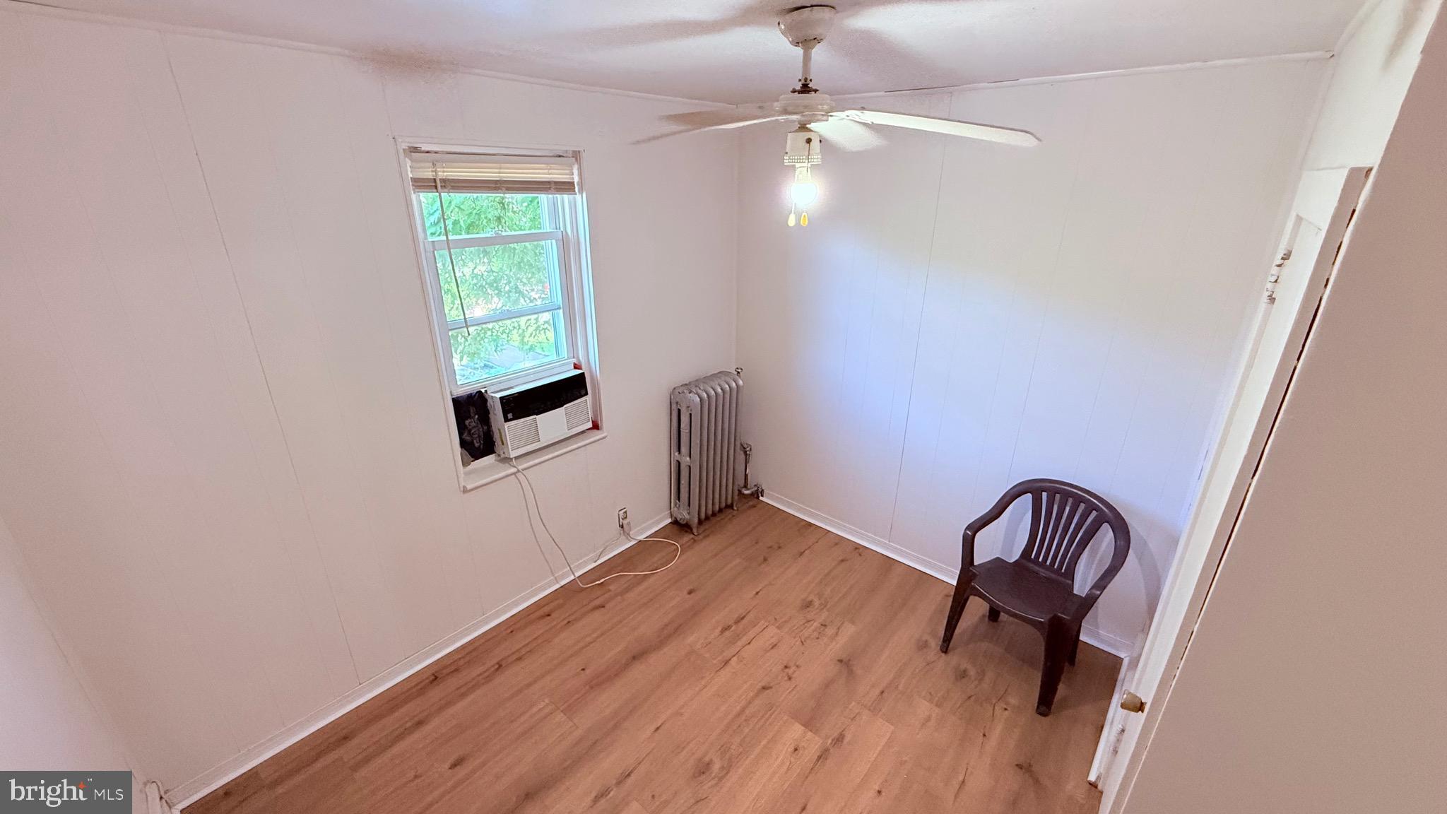 6424 Bingham Street Philadelphia, PA 19111 - Photo 20 of 32 wooden floor in a hall with a window