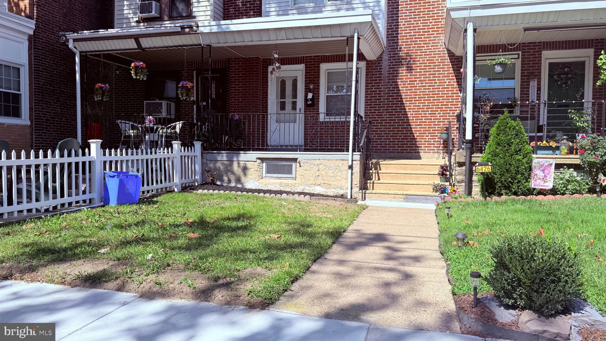 6424 Bingham Street Philadelphia, PA 19111 - Photo 2 of 32 a view of brick house with a yard and plants