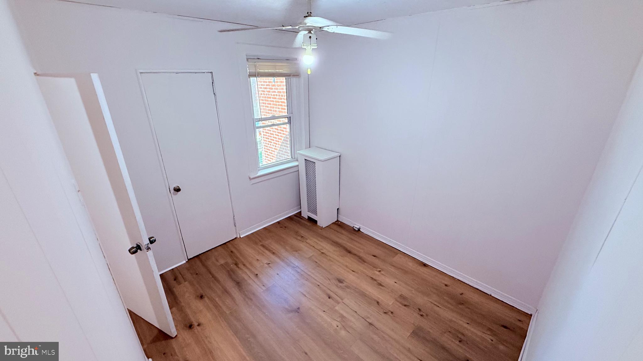 6424 Bingham Street Philadelphia, PA 19111 - Photo 21 of 32 a view of empty room with wooden floor and fan