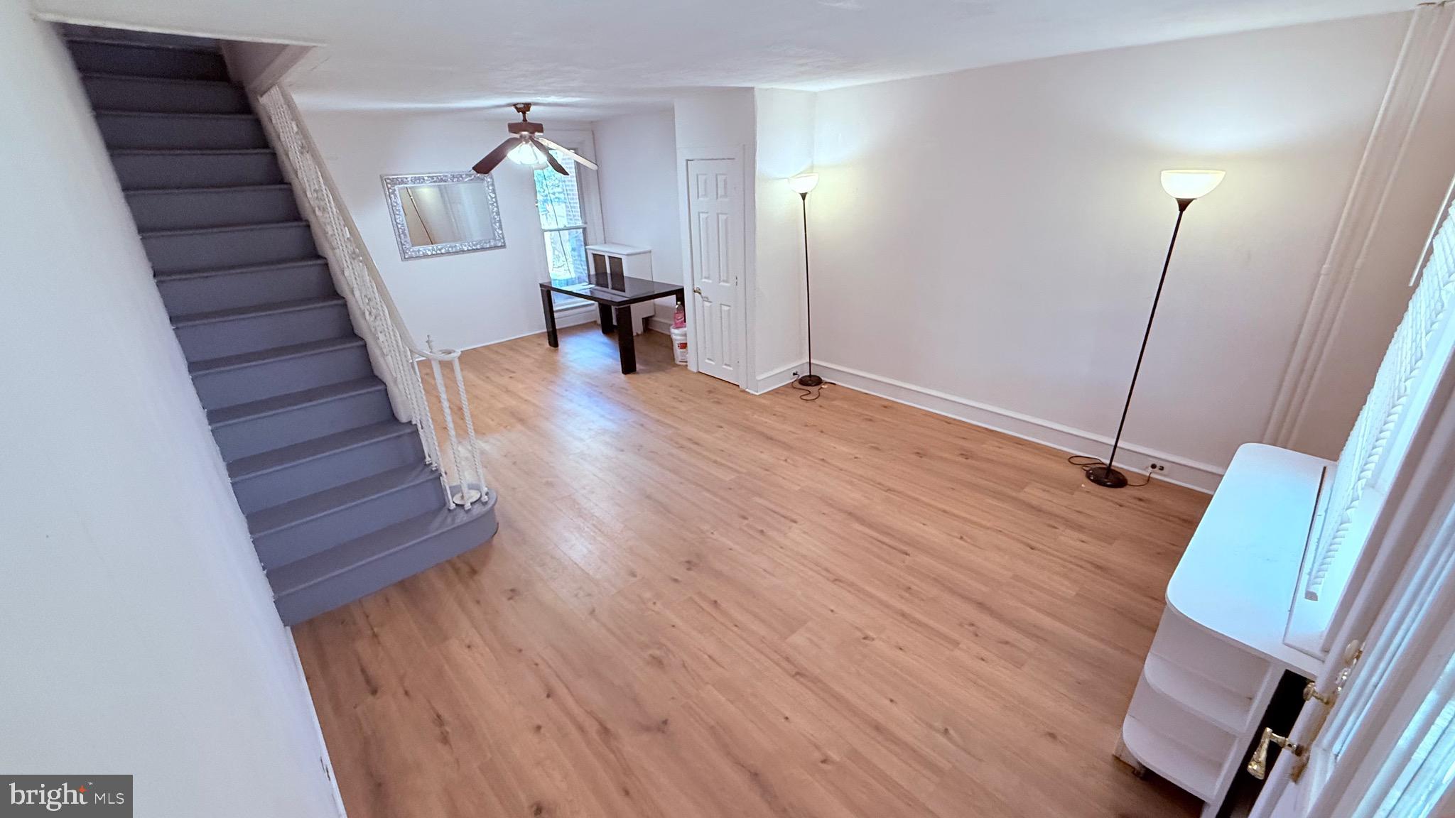 6424 Bingham Street Philadelphia, PA 19111 - Photo 4 of 32 a view of a hallway with wooden floor and stairs