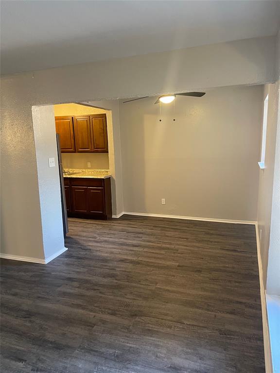5526 Reiger Avenue, Unit 104 Dallas, TX 75214 - Photo 3 of 14 a room with wooden floor and furniture