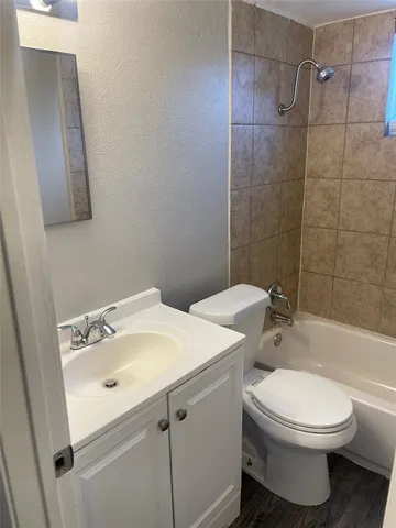 a bathroom with a bathtub and window