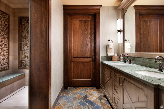 2322 North Westward Ho Road Heber City, UT 84036 - Photo 29 of 54 Bathroom with double vanity and dark stone finish floors