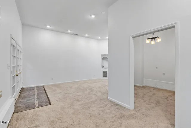 a living room with furniture and a book shelf