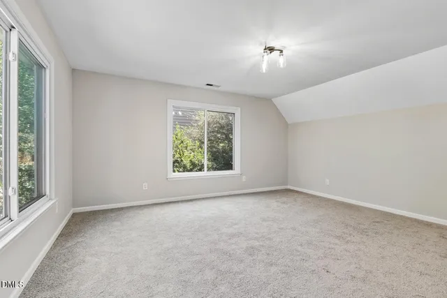 a view of balcony with wooden floor and fence