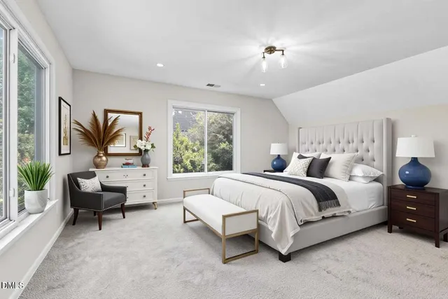 a view of a house with a yard and deck