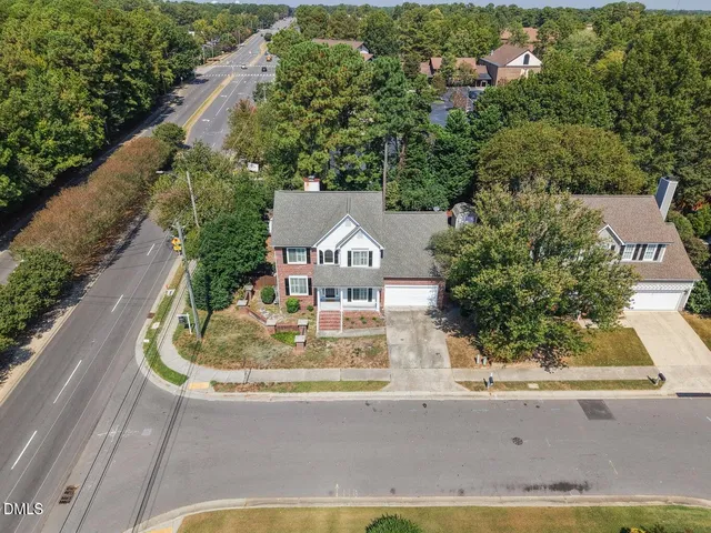 an aerial view of a house with a garden