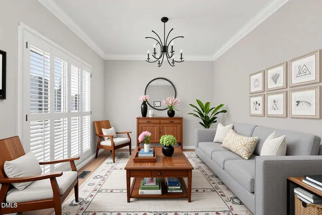 a view of a room with wooden floor and windows