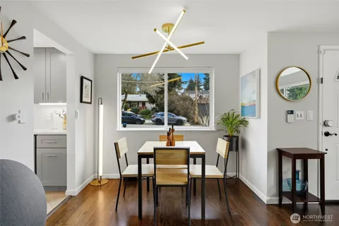 a view of a dining room with furniture window and wooden floor