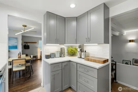 a kitchen with a sink cabinets and window
