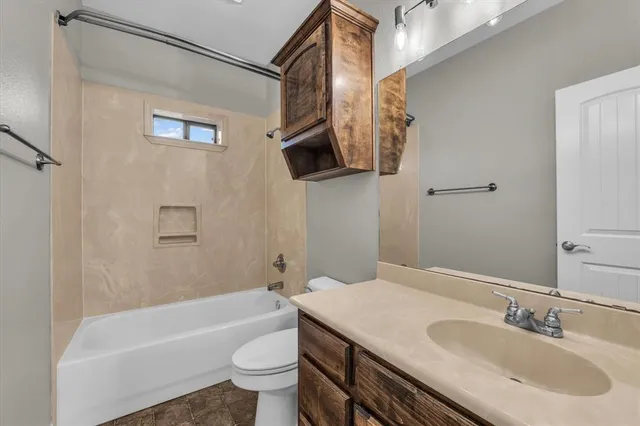 a bathroom with a sink a toilet and a bathtub