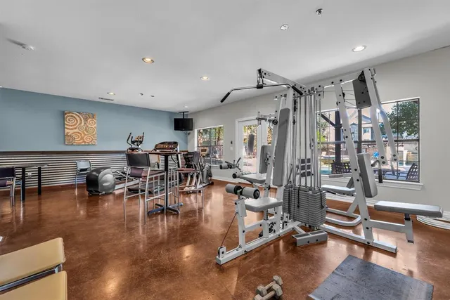 a view of a patio with a table chairs and a backyard
