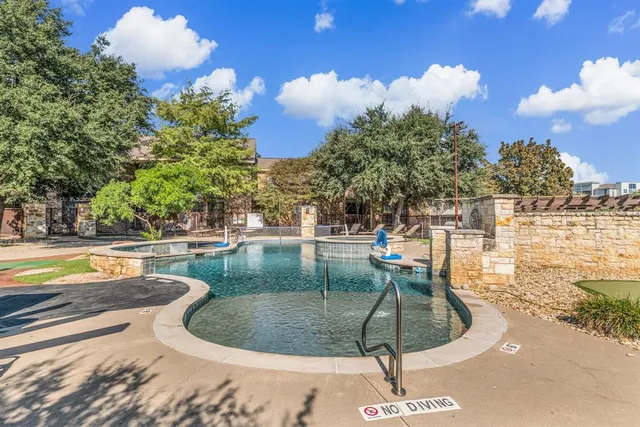 a view of a house with swimming pool and sitting area