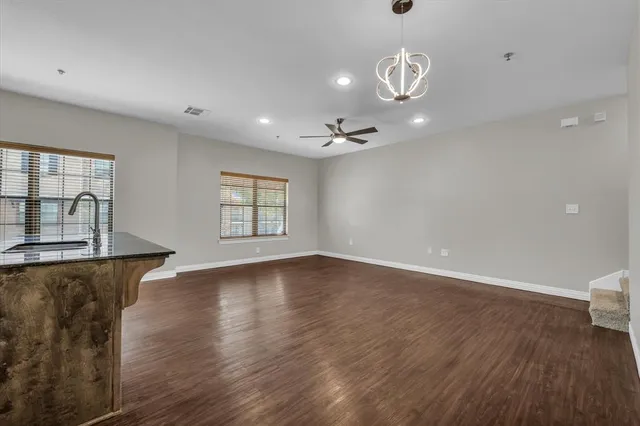 a view of kitchen with sink microwave and refrigerator