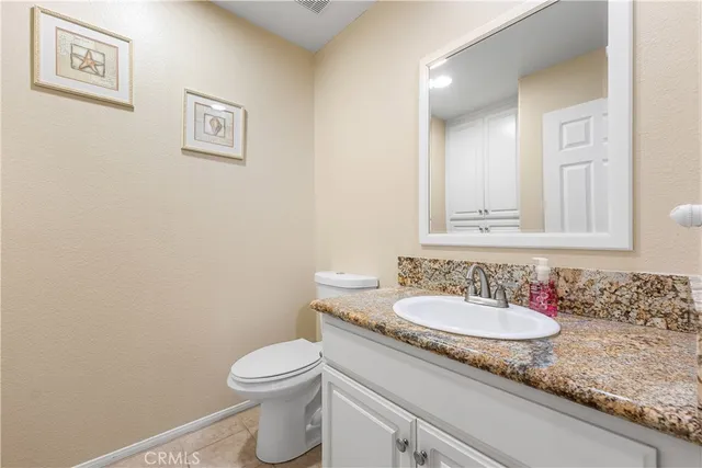 a view of a house with a backyard porch and sitting area