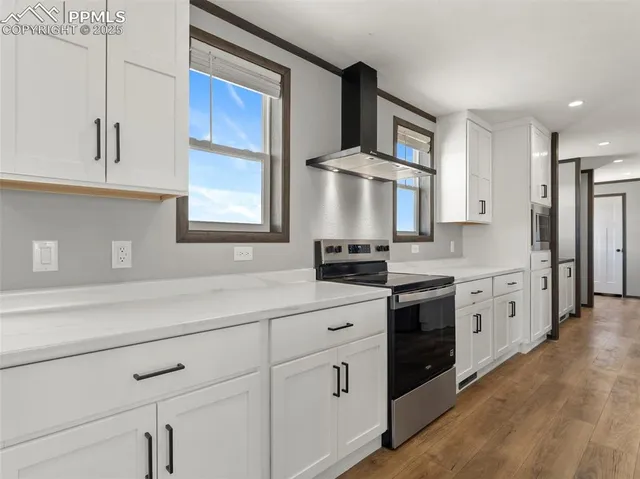 a kitchen with stainless steel appliances a sink stove and refrigerator