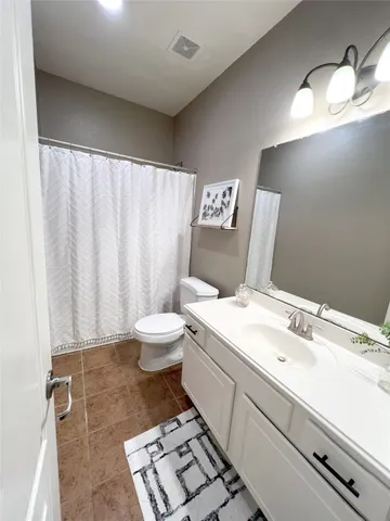a children room with furniture and chandelier