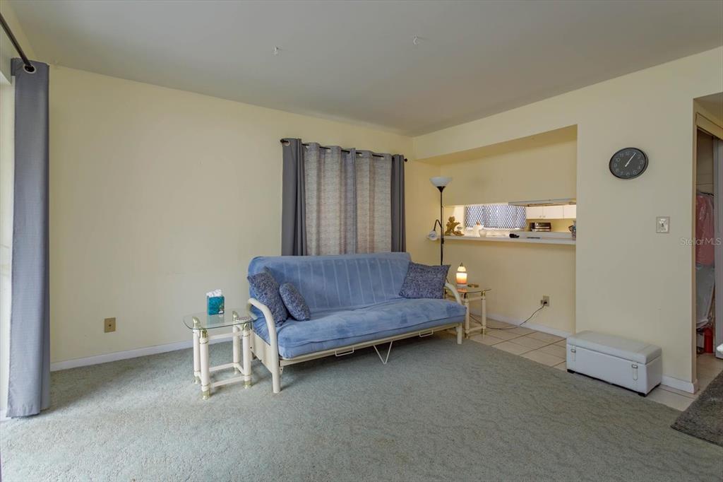 240 Orienta Point Street, Unit 240 Altamonte Springs, FL 32701 - Photo 4 of 20 a bedroom with a bed and a cabinets