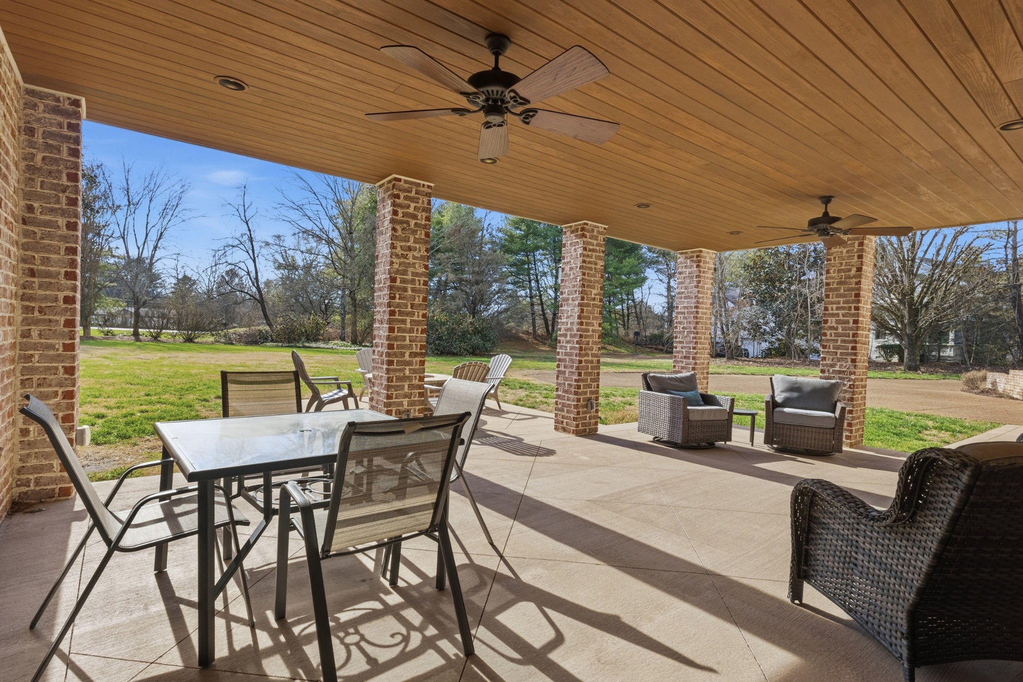 201 Lake Ridge Court Franklin, TN 37069 - Photo 41 of 59 a view of a patio with a table chairs and a backyard