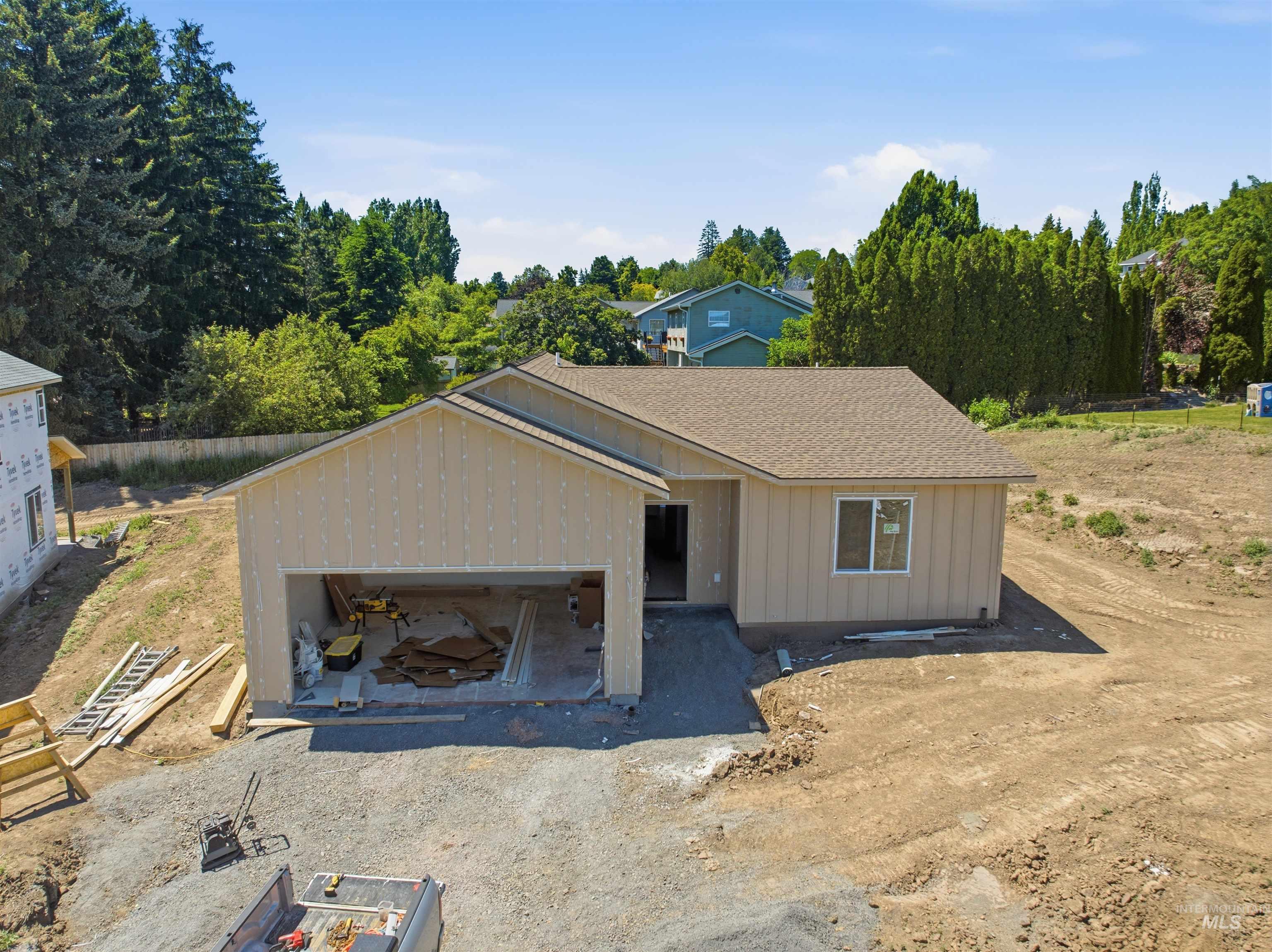 2812 Cyprus Court Moscow, ID 83843 - Photo 1 of 22 Newly constructed residence featuring white vertical siding and a brown shingle roof