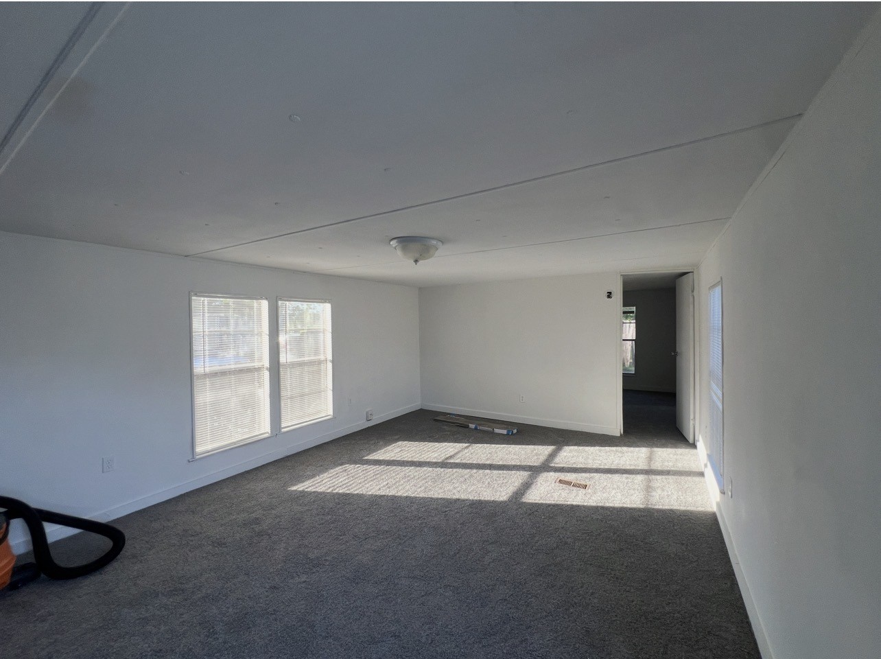 1511-1 Jones Street, Unit 1 Rosenberg, TX 77471 - Photo 9 of 13 an empty room with windows