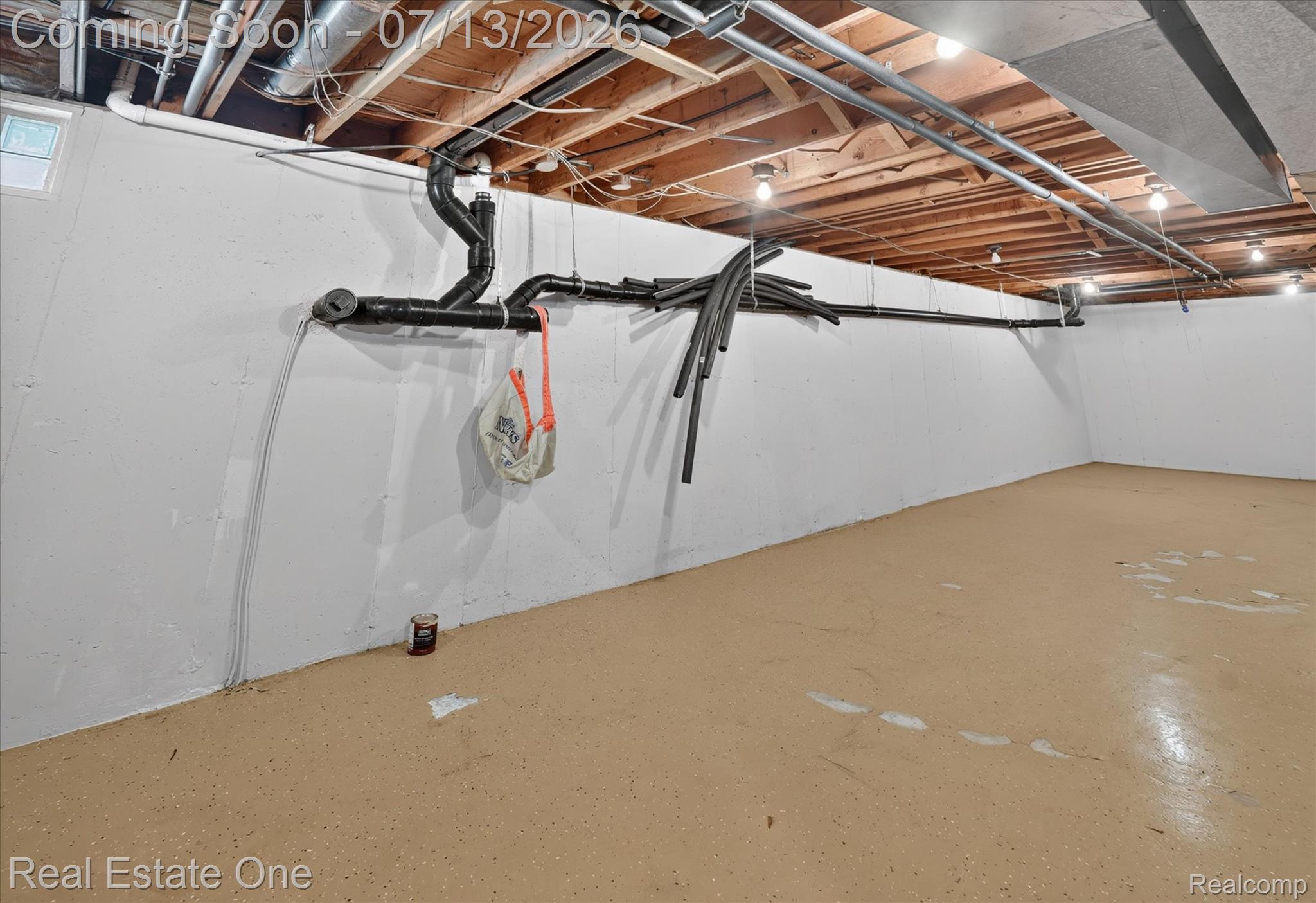 6039 Fish Lake Road Holly, MI 48442 - Photo 41 of 70 Spacious partially finished basement area with epoxy flooring.