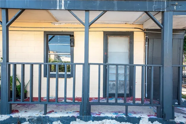 a front view of a house with large windows