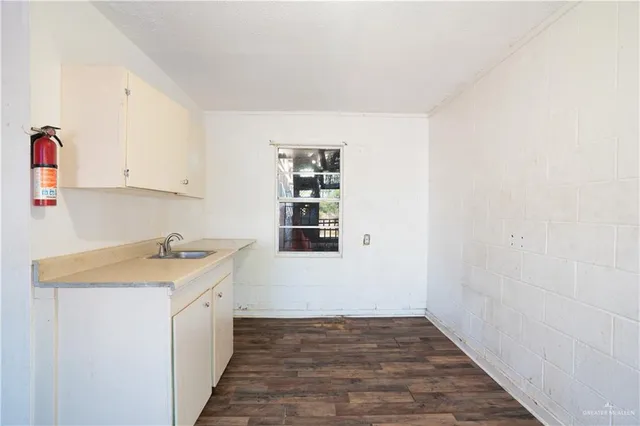 a view of a kitchen with a sink and dishwasher