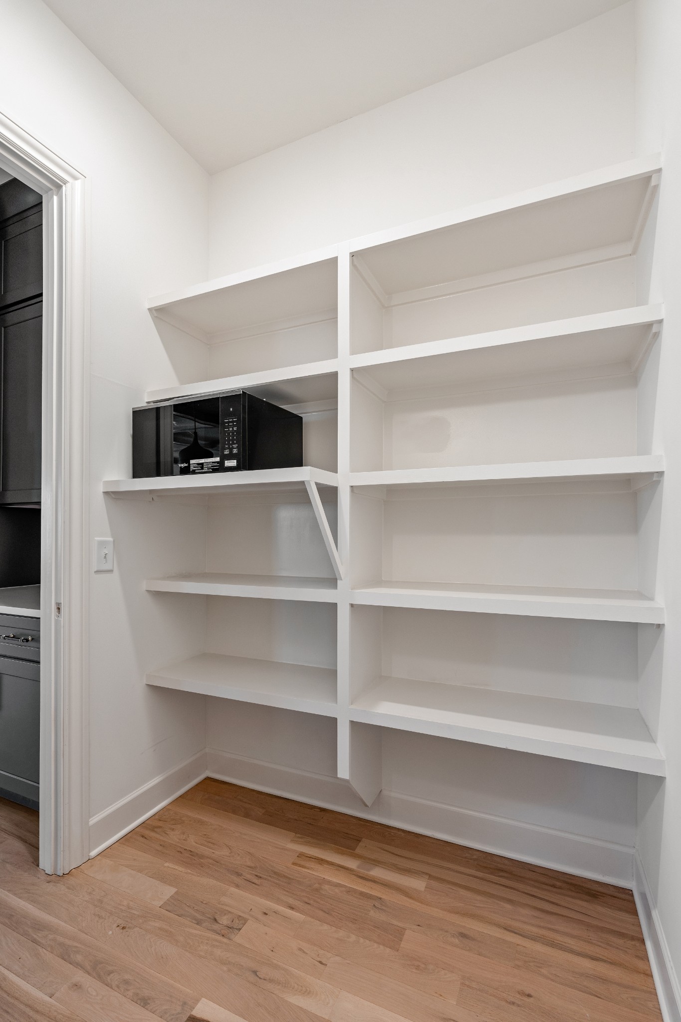 1037 Mitchell Road, Unit B Nashville, TN 37206 - Photo 15 of 50 a view of walk in closet with empty racks