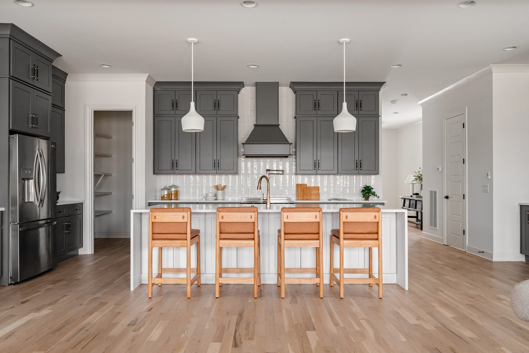 1037 Mitchell Road, Unit B Nashville, TN 37206 - Photo 17 of 50 a kitchen with stainless steel appliances kitchen island granite countertop a table chairs stove and cabinets