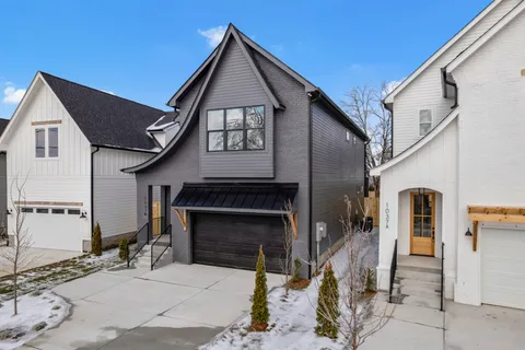 a front view of a house with garage