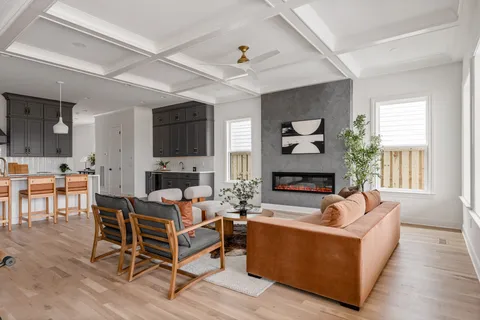 a view of a livingroom with furniture window and wooden floor