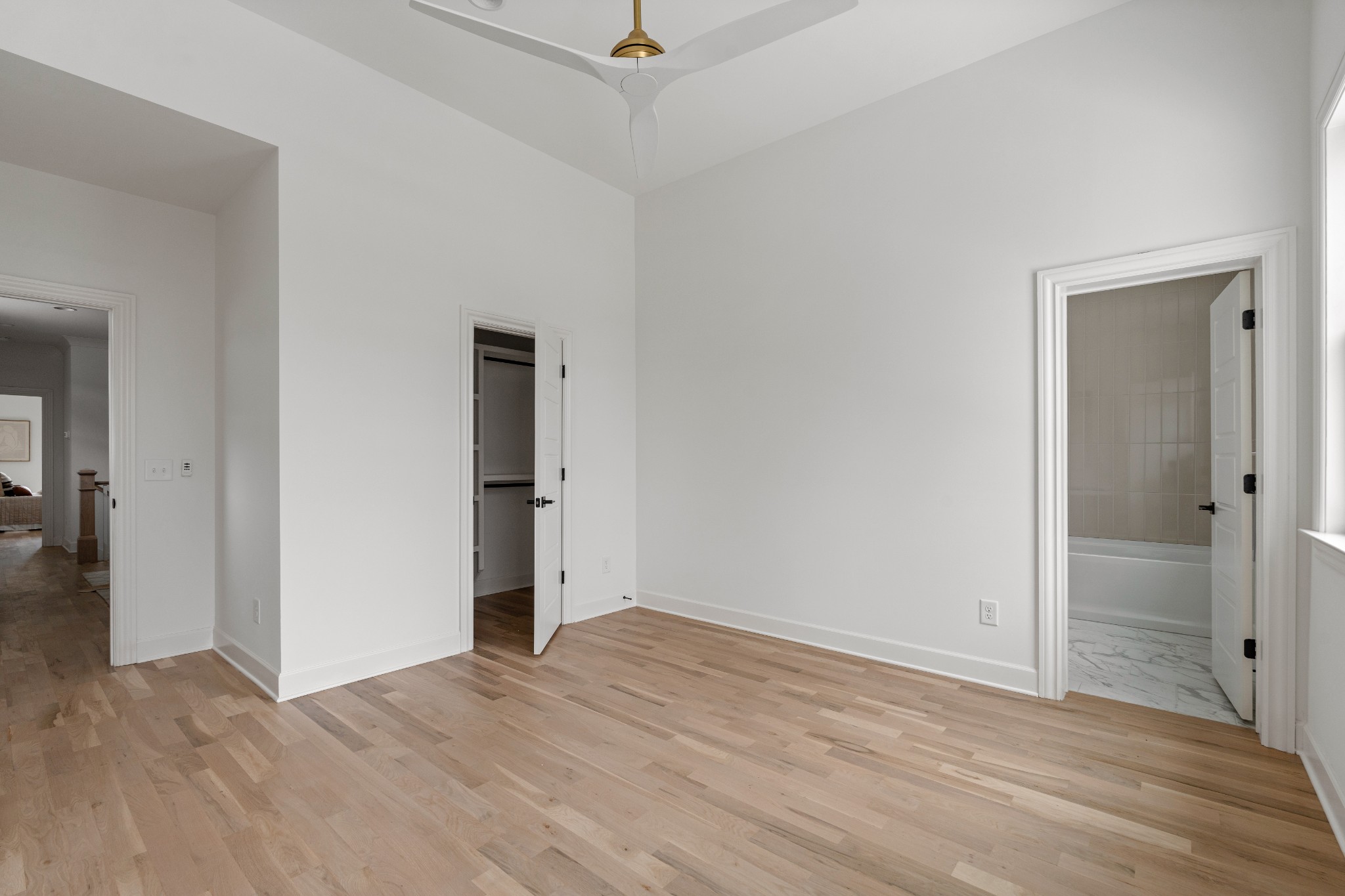 1037 Mitchell Road, Unit B Nashville, TN 37206 - Photo 31 of 50 a view of a room with wooden floor and a ceiling fan