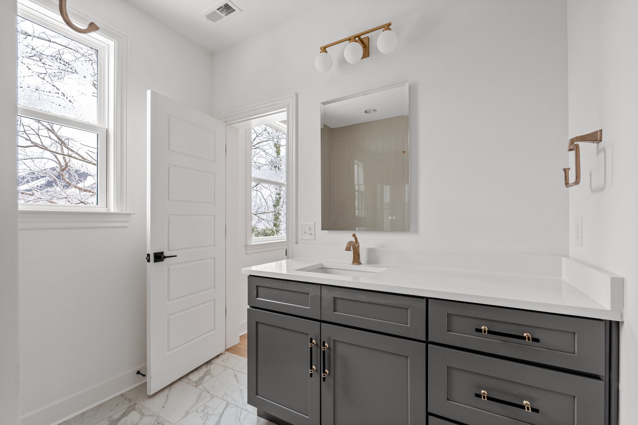1037 Mitchell Road, Unit B Nashville, TN 37206 - Photo 32 of 50 a bathroom with a sink and a mirror
