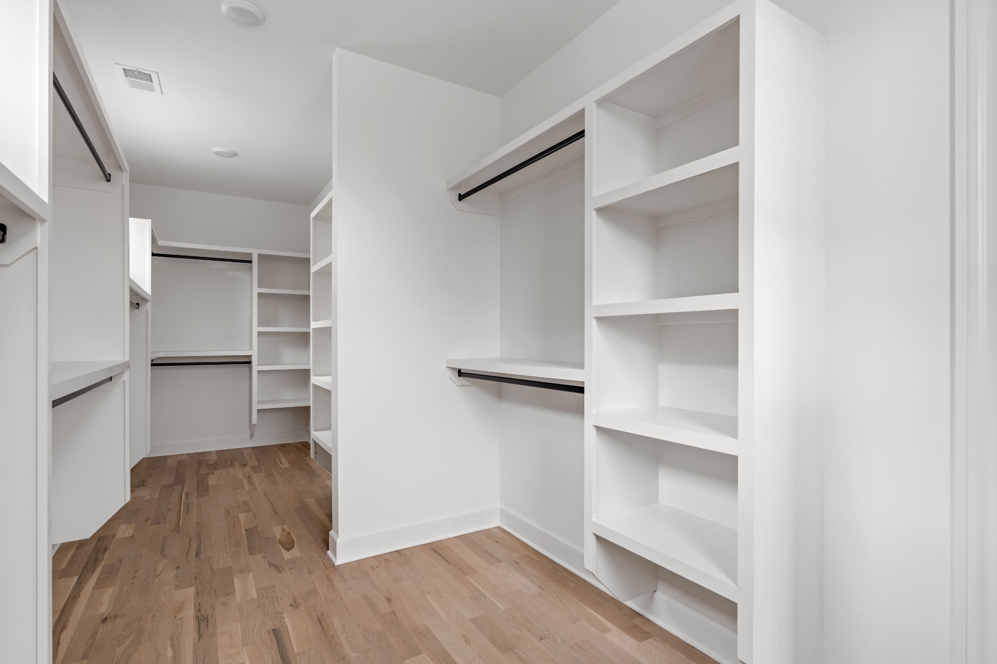 1037 Mitchell Road, Unit B Nashville, TN 37206 - Photo 43 of 50 a view of walk in closet with empty racks