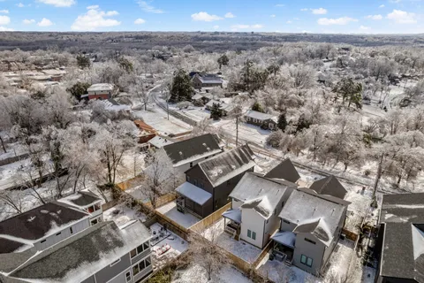 an aerial view of a house with a yard