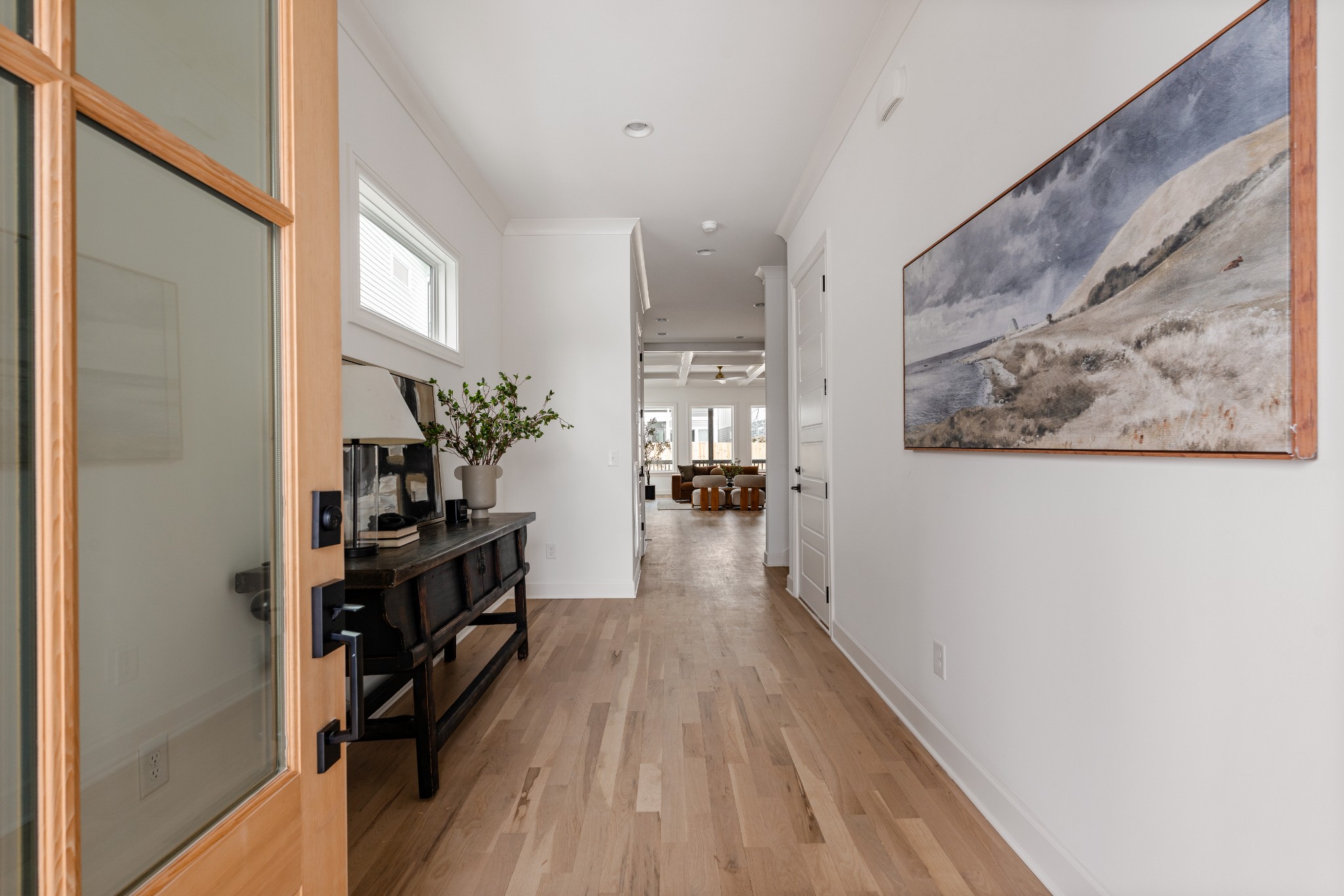 1037 Mitchell Road, Unit B Nashville, TN 37206 - Photo 5 of 50 a view of a hallway with wooden floor and a potted plant