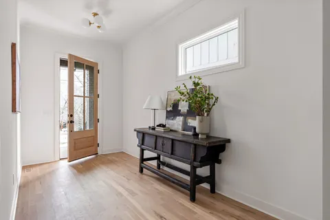 a view of a room with a table and chairs