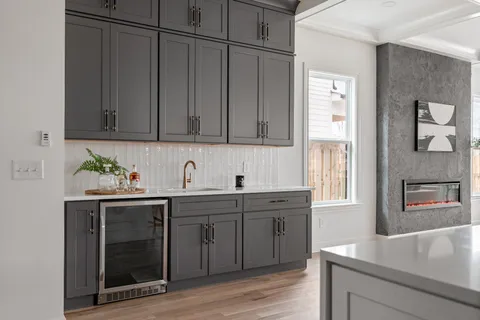 a kitchen with stainless steel appliances granite countertop a sink and a stove