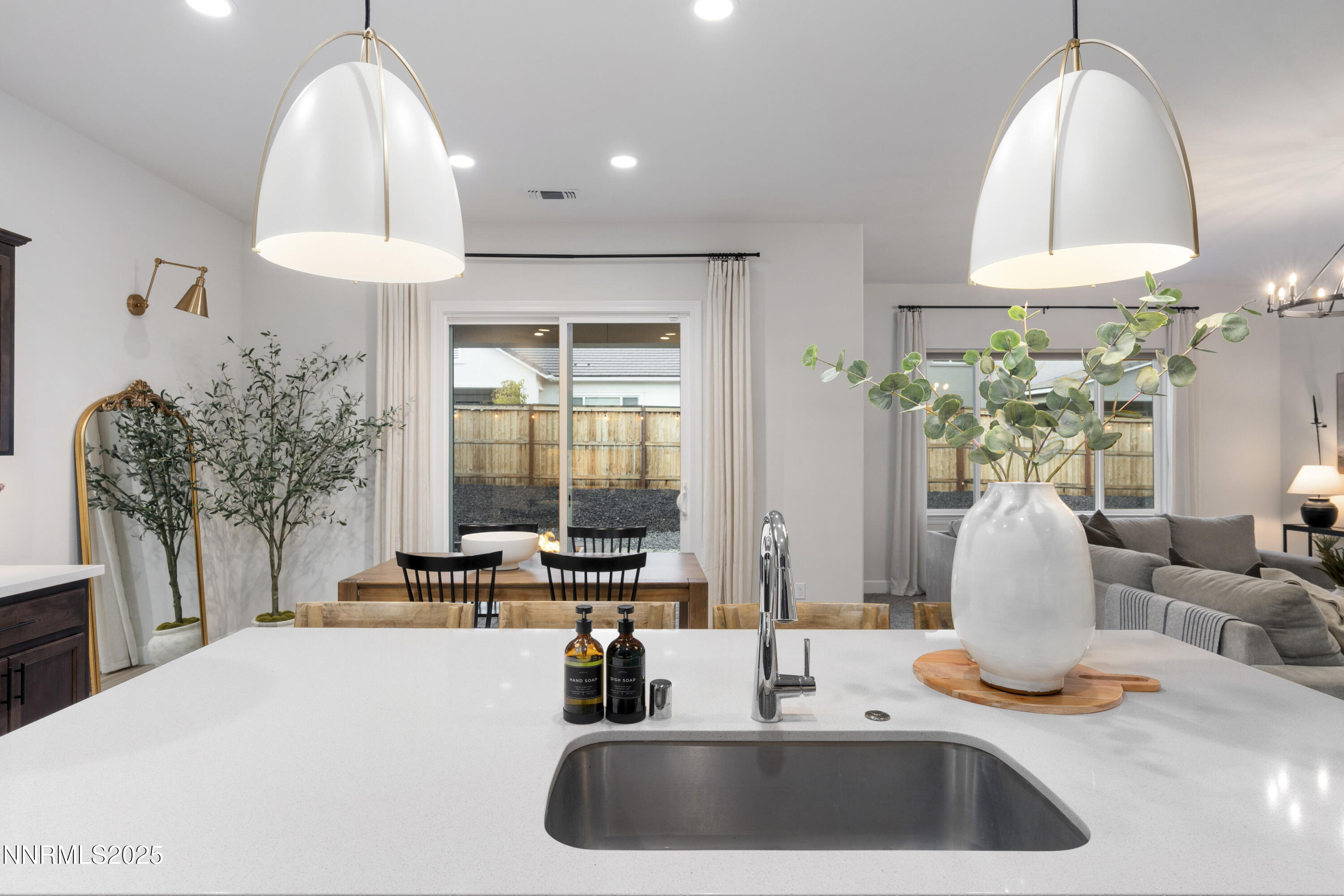 247 Starboard Drive Verdi, NV 89439 - Photo 11 of 41 a kitchen with a chandelier a sink and a stove