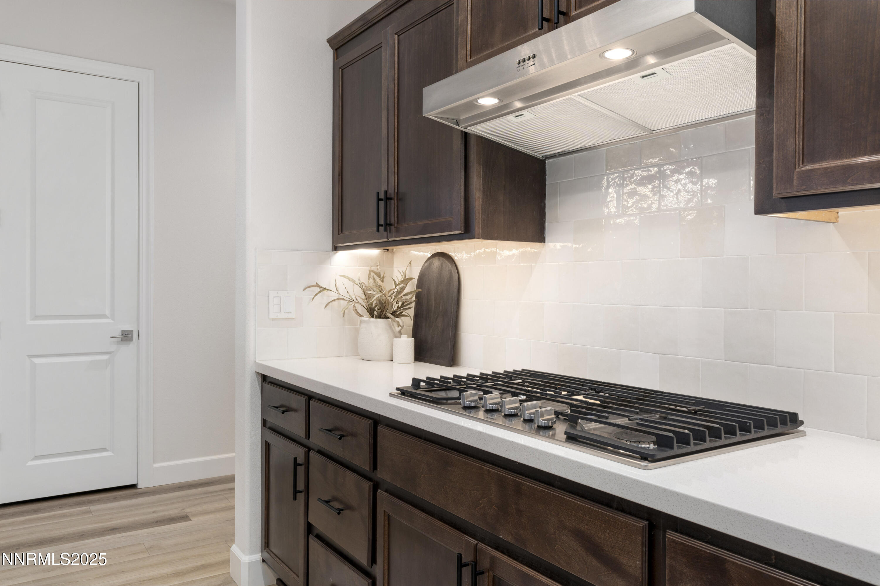 247 Starboard Drive Verdi, NV 89439 - Photo 12 of 41 a kitchen with a stove and a white cabinet