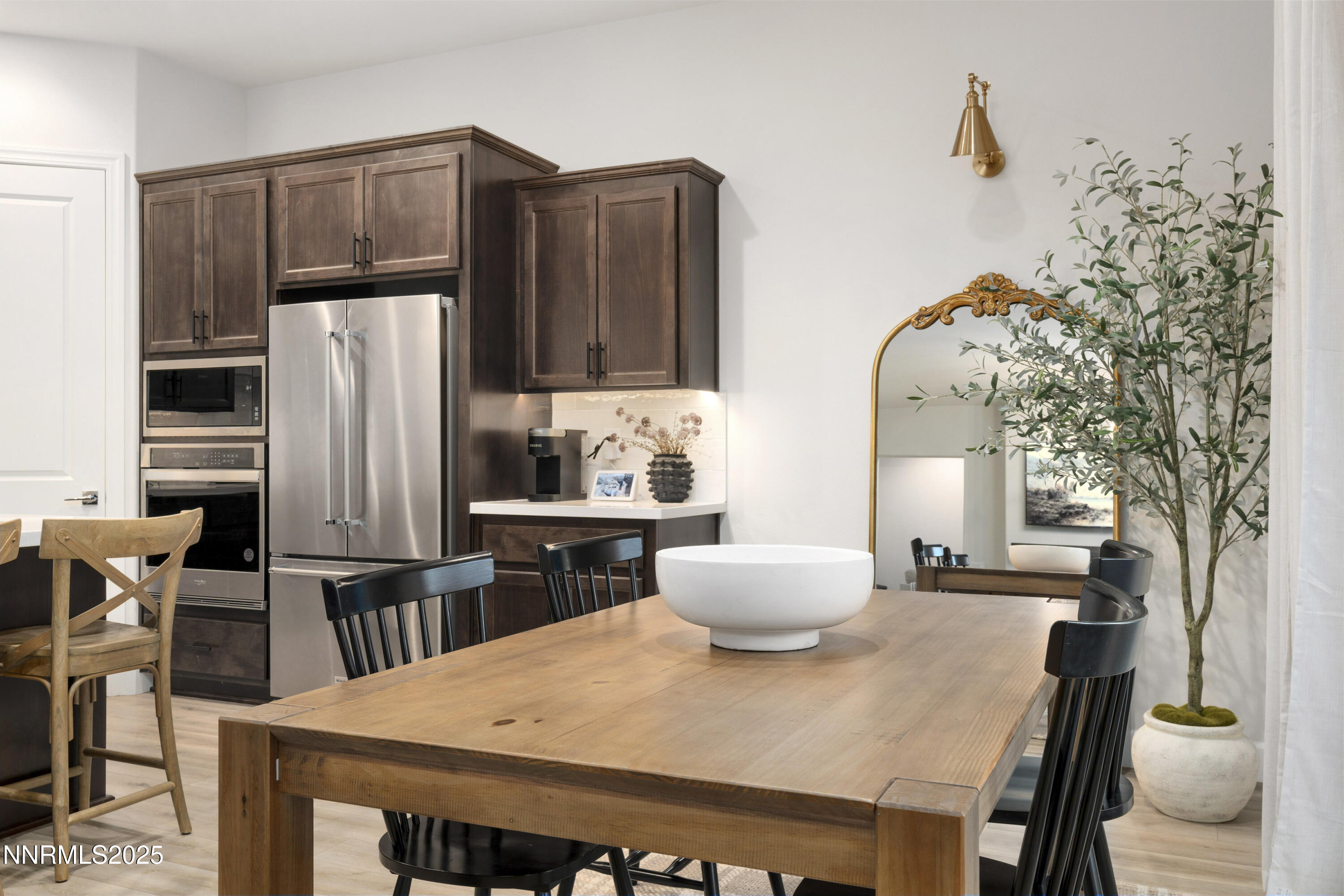 247 Starboard Drive Verdi, NV 89439 - Photo 13 of 41 a kitchen with stainless steel appliances a dining table and chairs