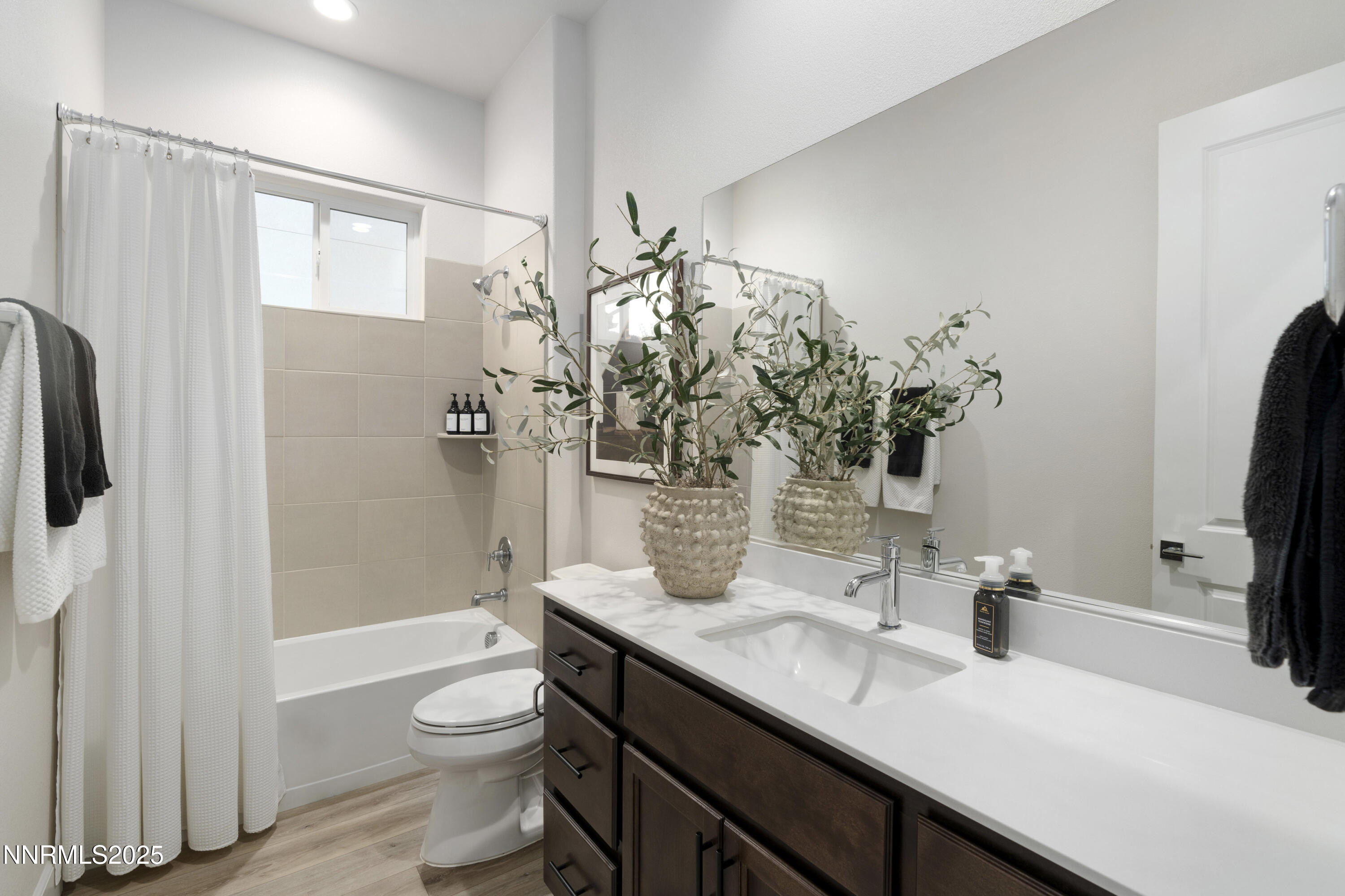 247 Starboard Drive Verdi, NV 89439 - Photo 15 of 41 a bathroom with a granite countertop sink a toilet and shower