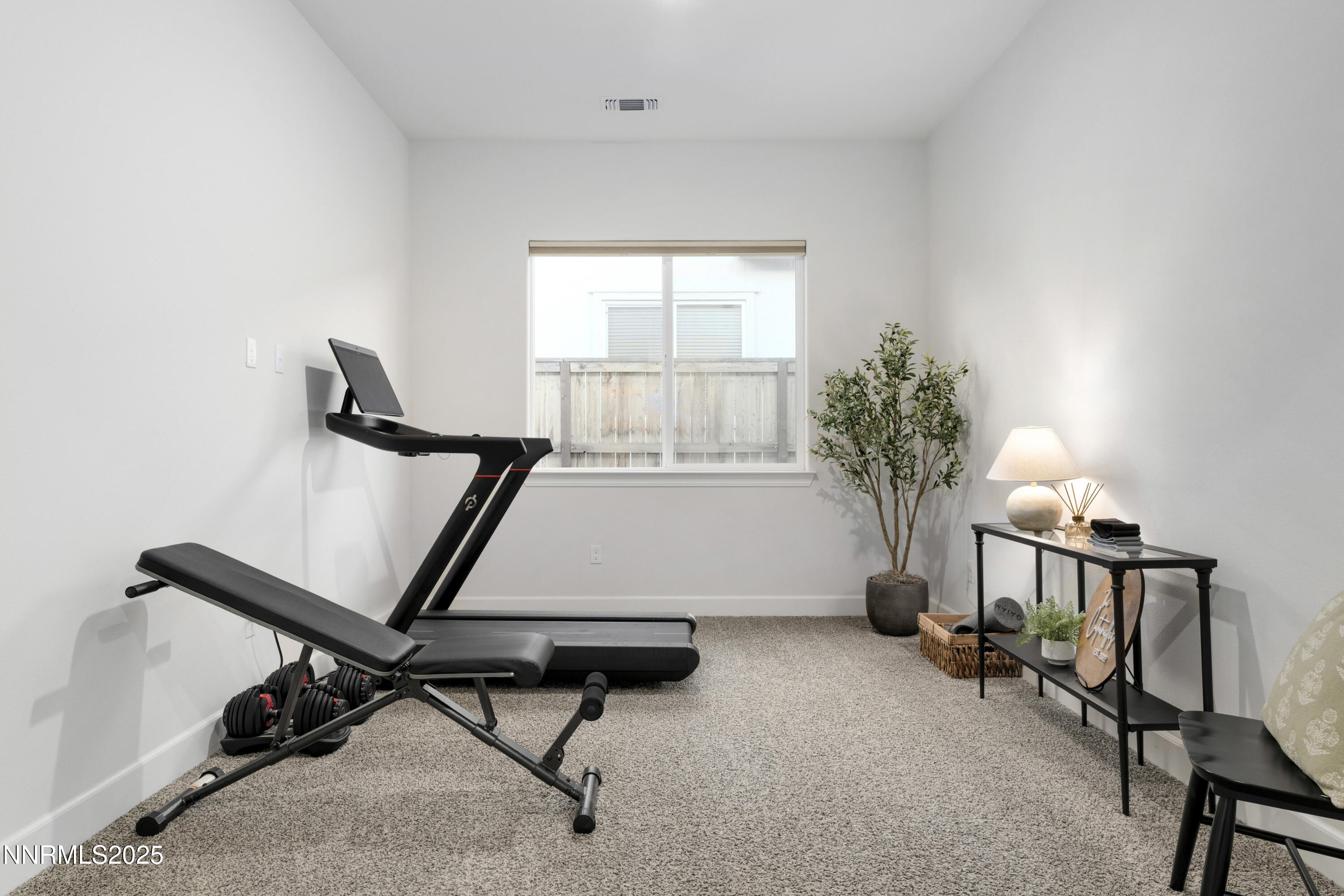 247 Starboard Drive Verdi, NV 89439 - Photo 16 of 41 a room with gym equipment and a window