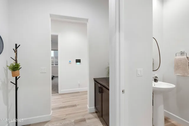 a view of a bathroom from a hallway