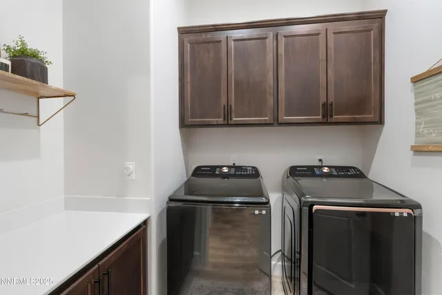 a kitchen with a sink a stove and cabinets