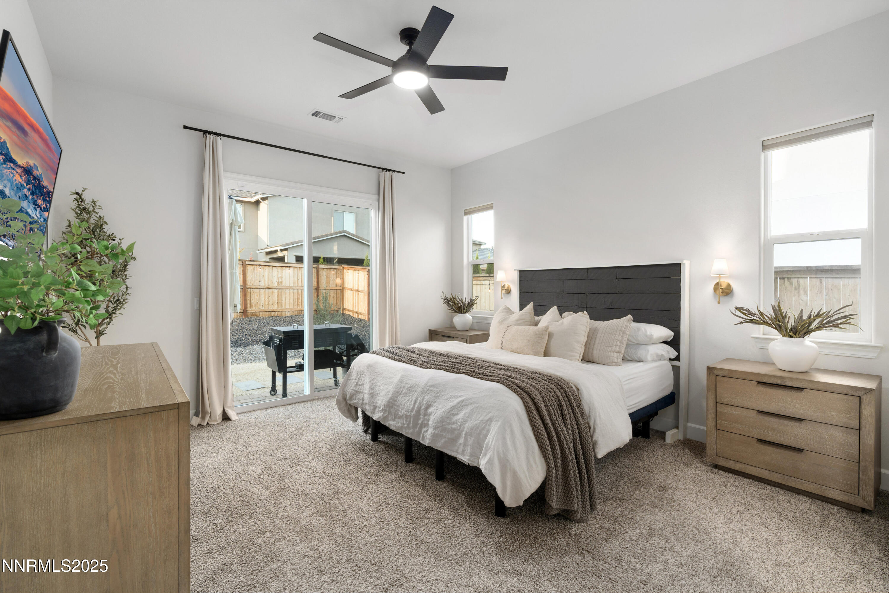 247 Starboard Drive Verdi, NV 89439 - Photo 19 of 41 a spacious bedroom with a bed and a potted plant