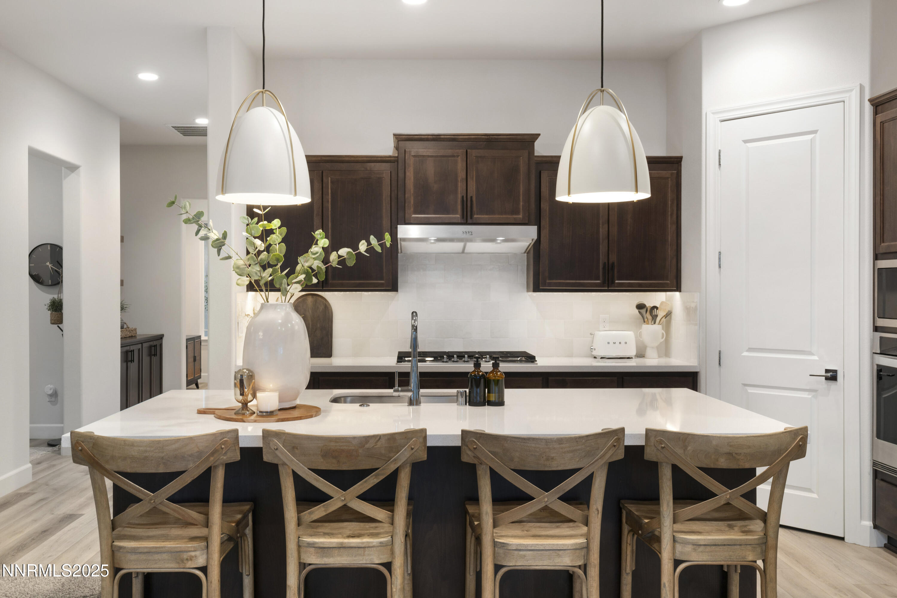 247 Starboard Drive Verdi, NV 89439 - Photo 2 of 41 a kitchen with a table chairs stove and cabinets