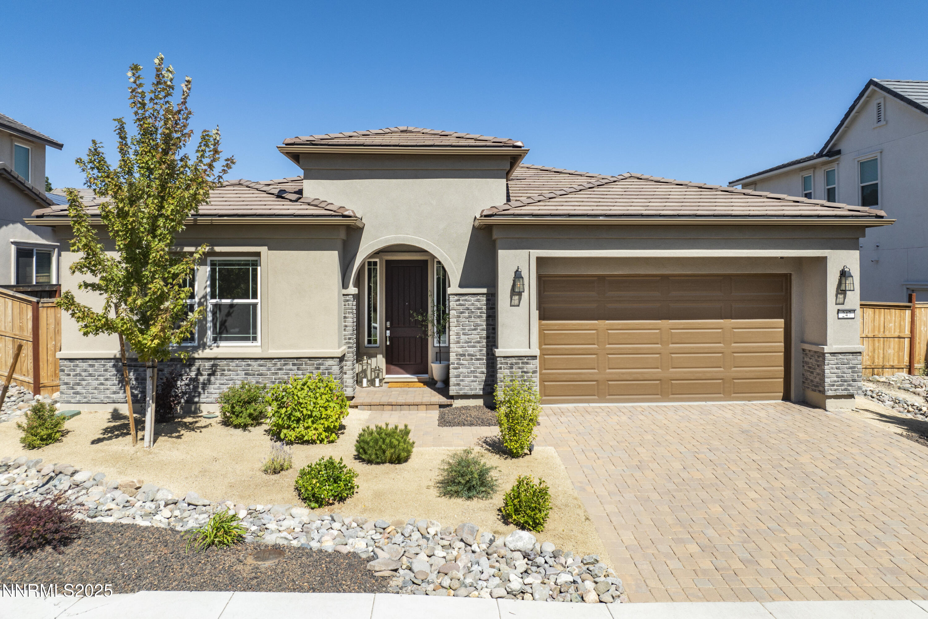 247 Starboard Drive Verdi, NV 89439 - Photo 29 of 41 a front view of a house with a yard and garage