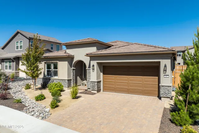 a front view of a house with a outdoor space